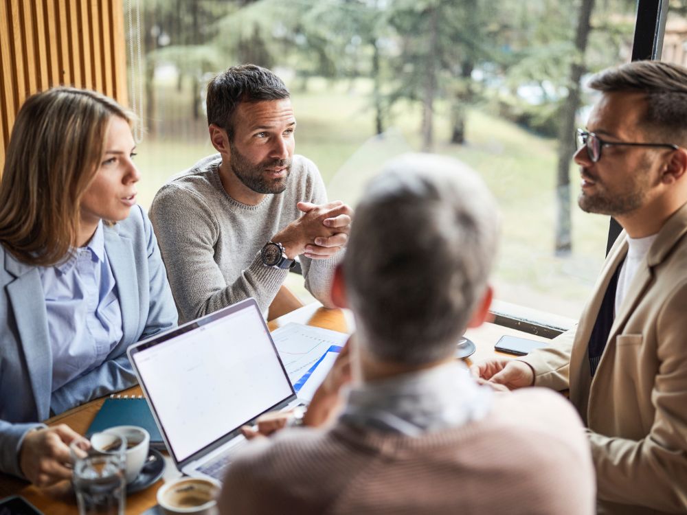 Group of businesspeople discuss the future with a nature perspective